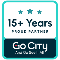 A badge with a teal blue border a white rounded square top and a dark blue rounded rectangle bottom. The white space has three teal stars above the words 15+ Years Proud Partner. The dark blue space has a white GoCity logo with the words And Go See It All written underneath.