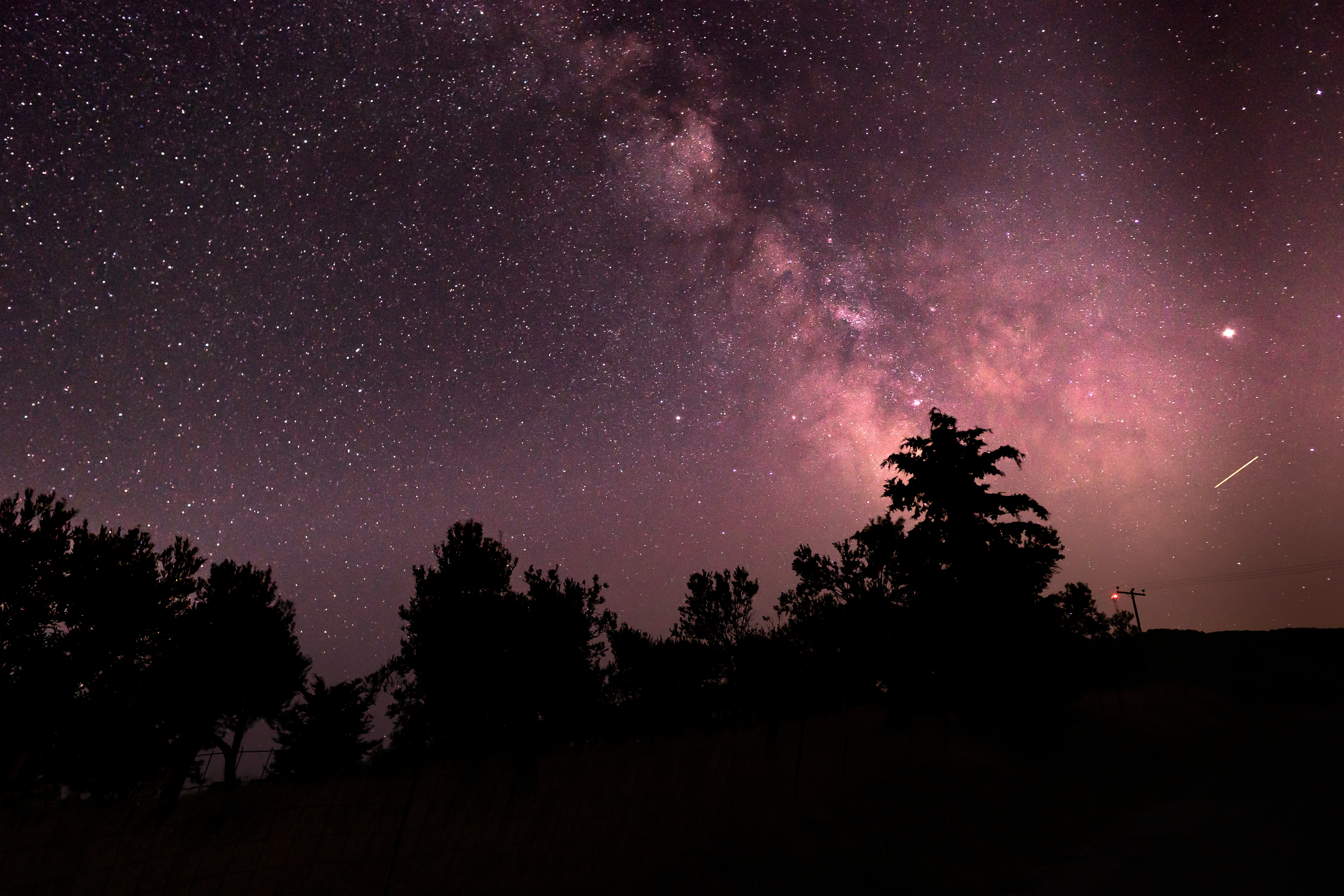 Night sky with stars and a meteorite streak