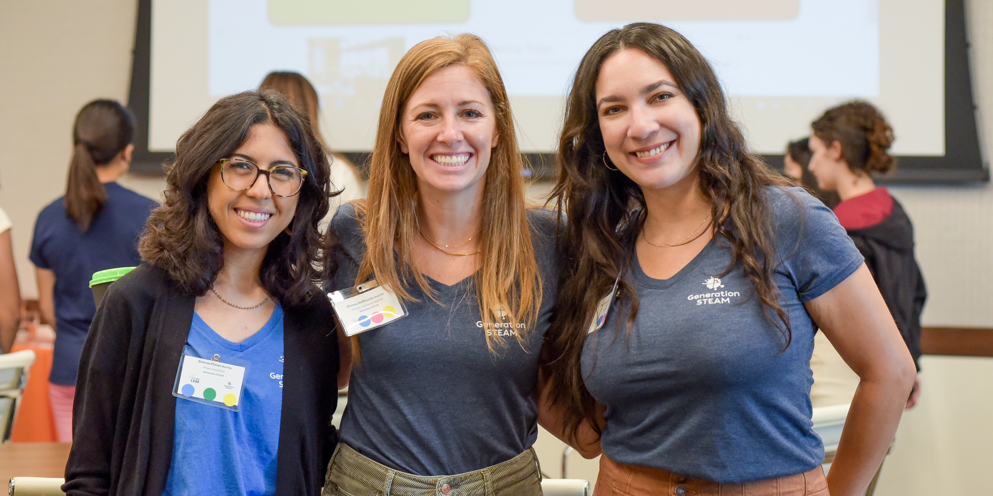 Three women smiling as part of a BEWiSE event.