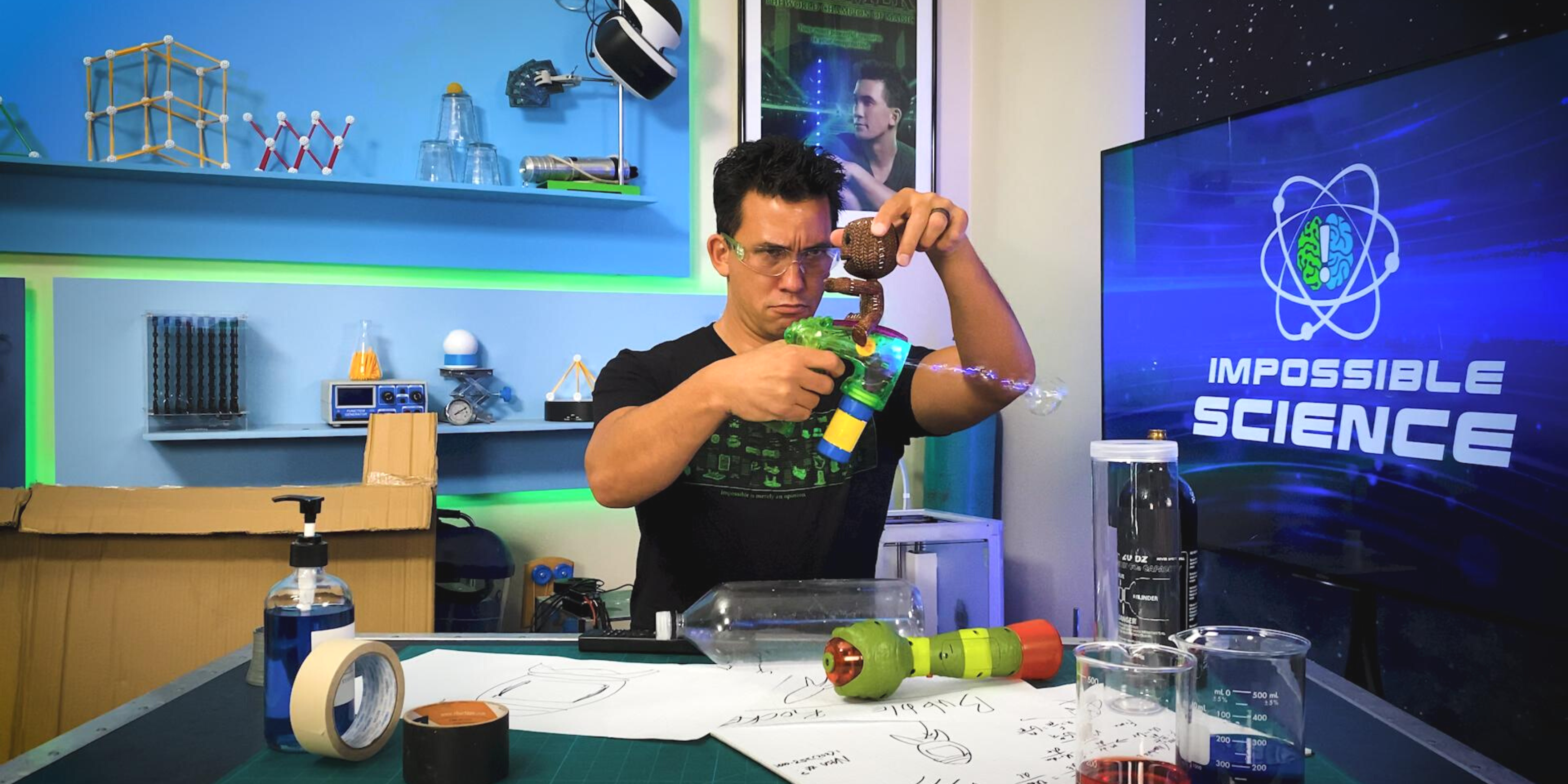 Photo of science educator Jason Latimer experimenting with a bubble gun in the Impossible Science studio.