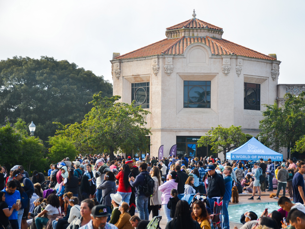 Image of the Fleet Science Center building with a crowd in front of it.