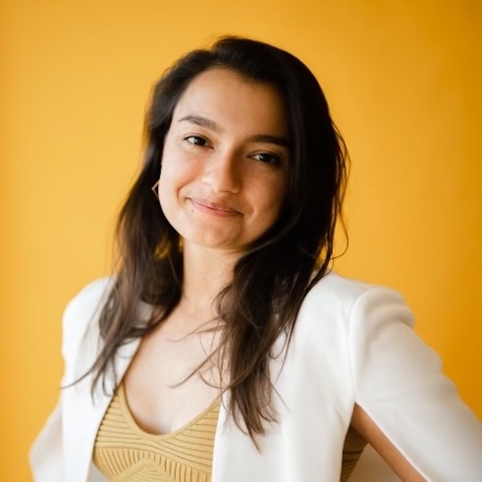 A portrait of a woman smiling warmly  