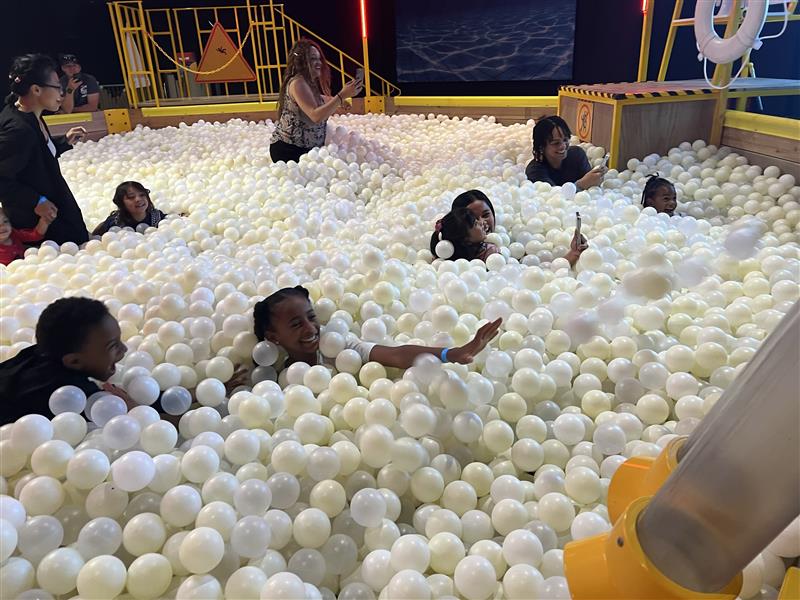 Families enjoy the Ball Pool at a Community Morning
