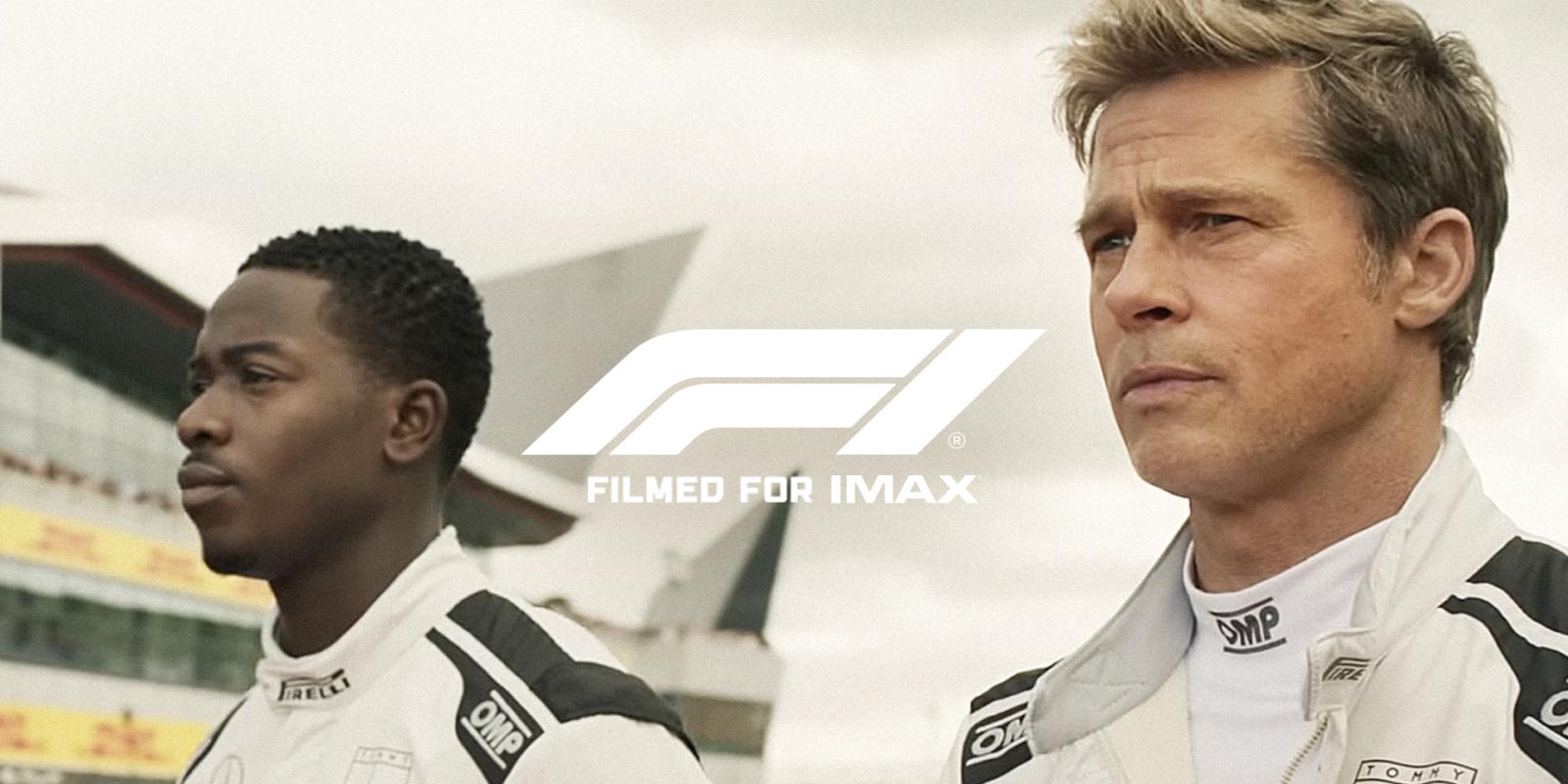 Two race car drivers in white suits on a track with the F1 IMAX logo.