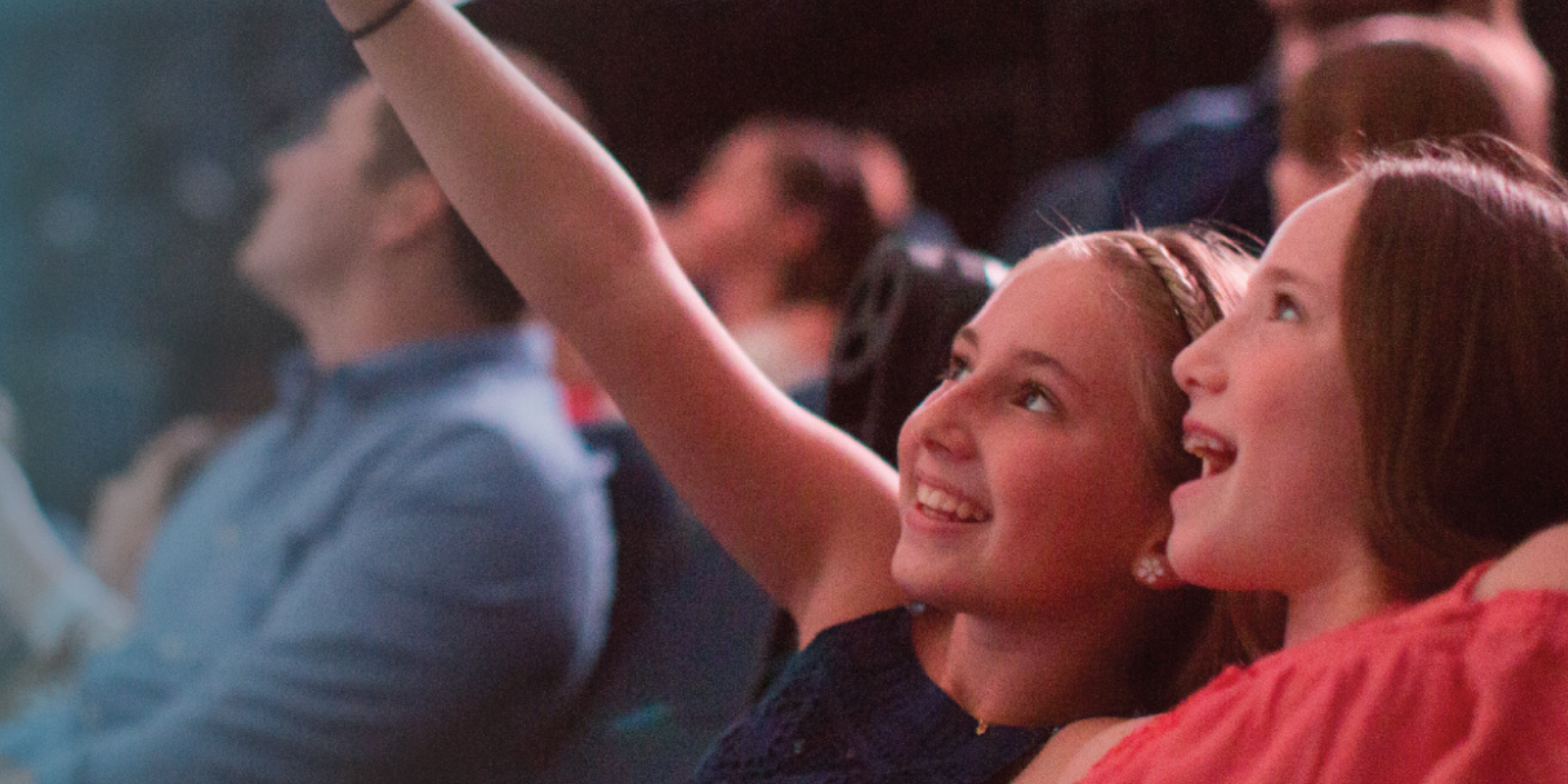 Girl points at film on the giant dome theater