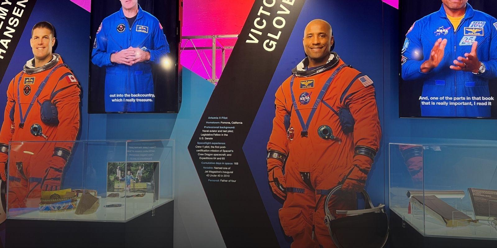 Artemis II astronaut Victor Glover and accompanying exhibit