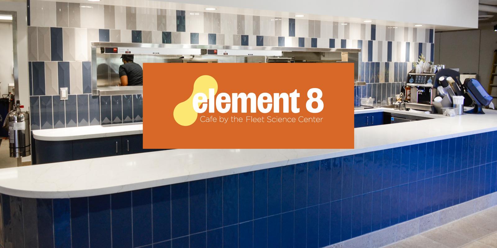 Element 8 Cafe interior. the counter has white and blue tiles. A woman is on the background.