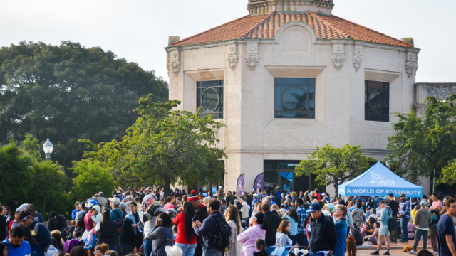Image of the Fleet Science Center building with a crowd in front of it.