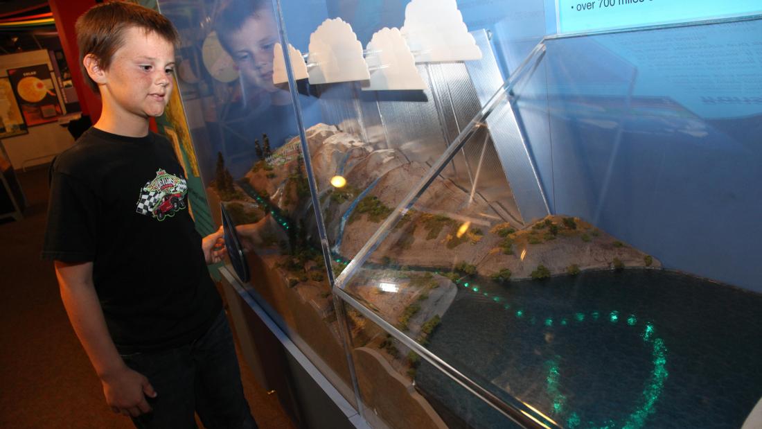 Student interacting with water deliver at the San Diego's Water experience