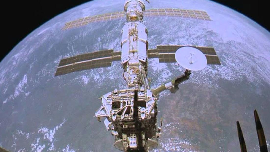 The international space station floating above the earth against a black sky