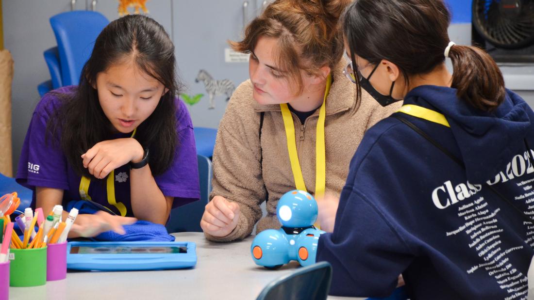 Three girls working together on an iPad