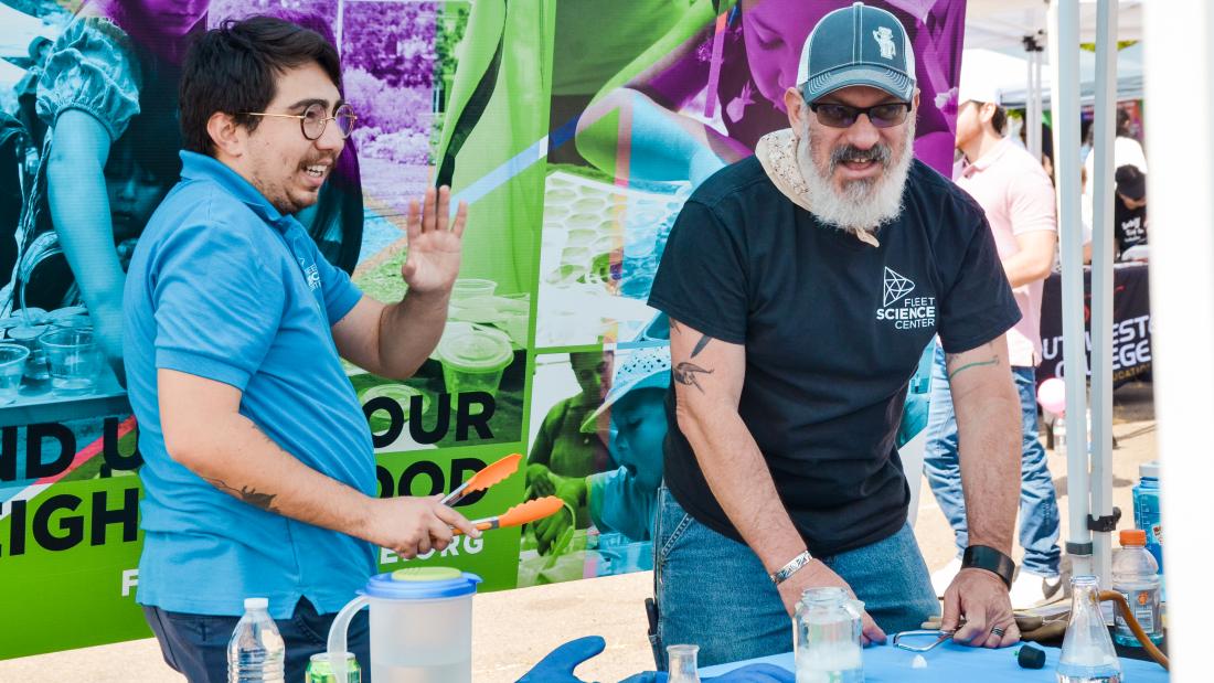 Two men doing a science experiment