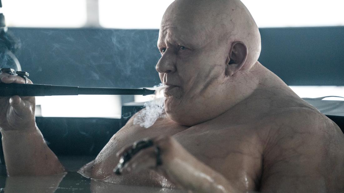 Production still from Dune part two of a male villain sitting in a bathtub