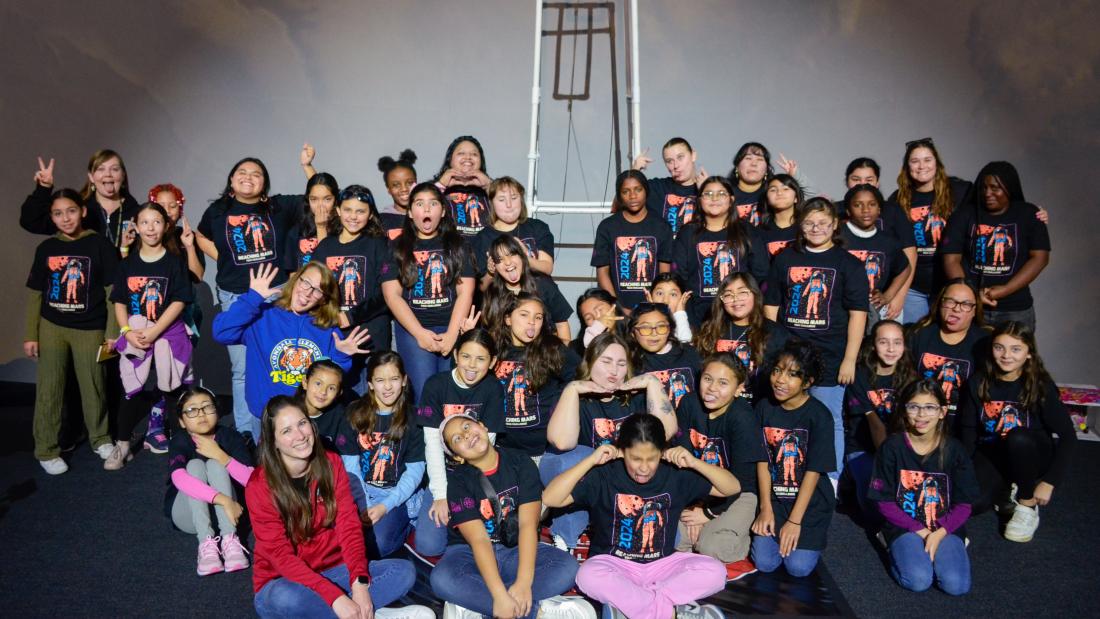 A large group of girls and woman posing with funny faces and gestures