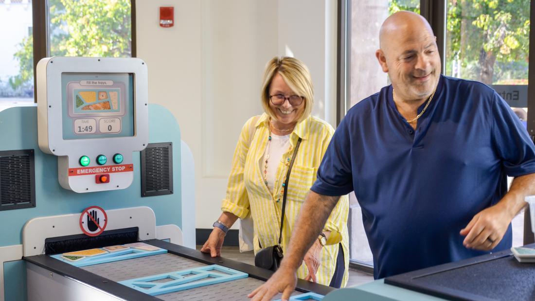 Family engaging with Mindbender Mansion