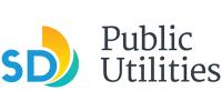 A blue SD with a arc of color wrapping from bottom right of the D to top center of the D. The colors are yellow and then a separate swipe of green blue. The words 'Public Utilities' are stacked next to the SD logo.