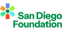 A logo for the San Diego Foundation. There is a stylized burst or flower in the upper left that is multi colored. The text is written in green to the right and says San Diego Foundation sponsor logo