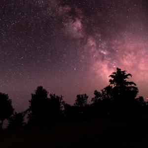 Night sky with stars and a meteorite streak