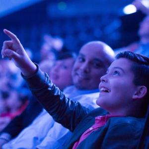 Child pointing at dome screen in Heikoff Giant Dome Theater