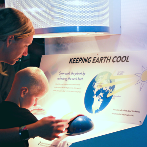 Mother and son enjoying the SNOW exhibition at the Fleet Science Center