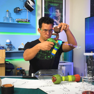 Photo of science educator Jason Latimer experimenting with a bubble gun in the Impossible Science studio.