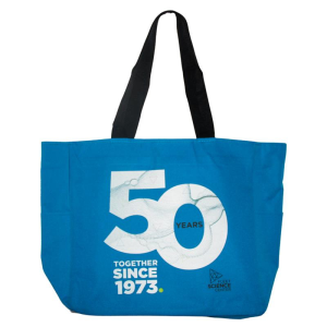 Blue tote bag with black handles and a design that reads 50 years, together since 1973, and the Fleet logo.