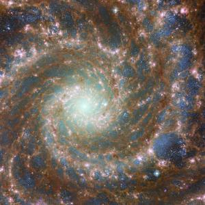 JWST Hubble image of galaxy with swirls and stars