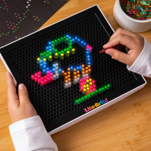 LiteBrite with pegs forming a colorful image of an elephant 