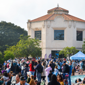 Image of the Fleet Science Center building with a crowd in front of it.